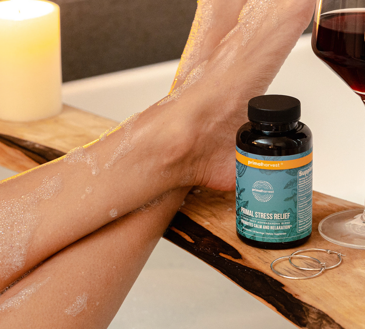 Relaxing woman in bath tub with stress relief supplement