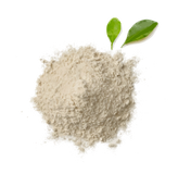 Powdered substance with two green leaves on a white background